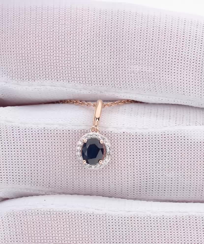 Gold pendant with sapphire and diamonds