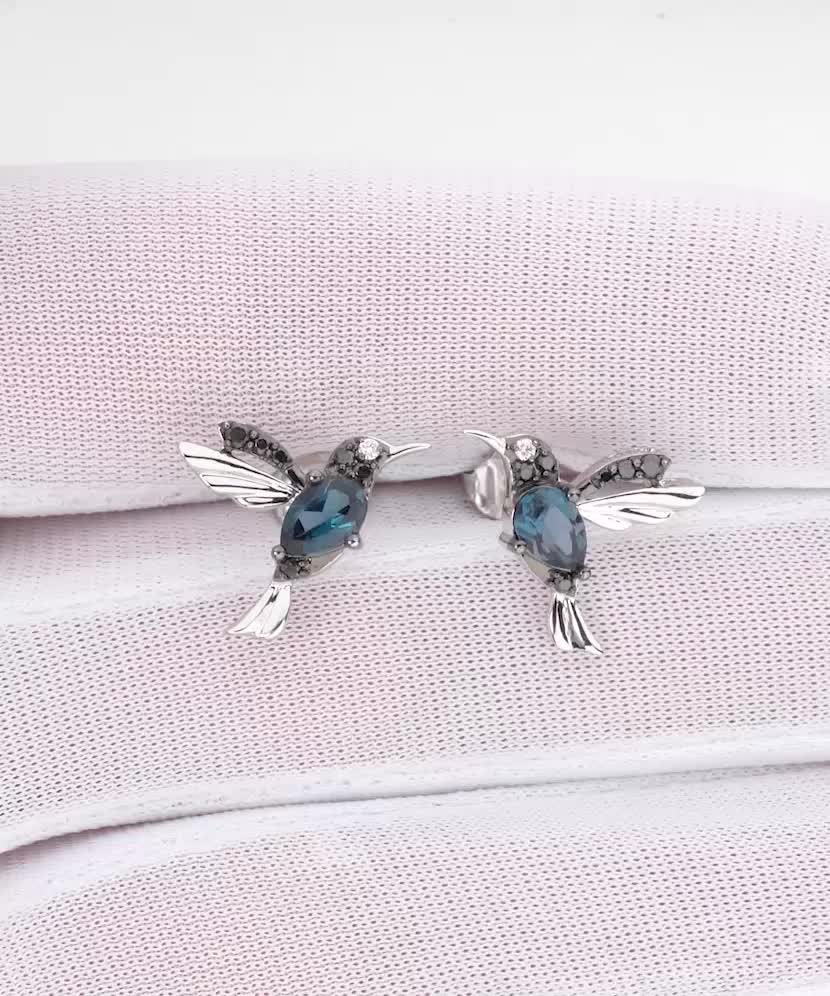 White gold earrings with diamonds, black diamonds and topazes