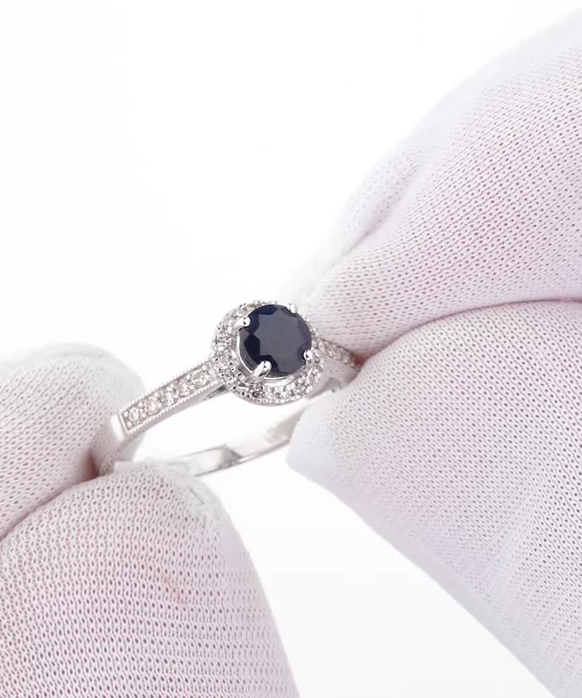 White gold ring with sapphires and diamonds