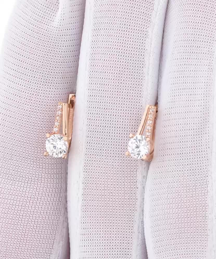 Gold earrings with zircons