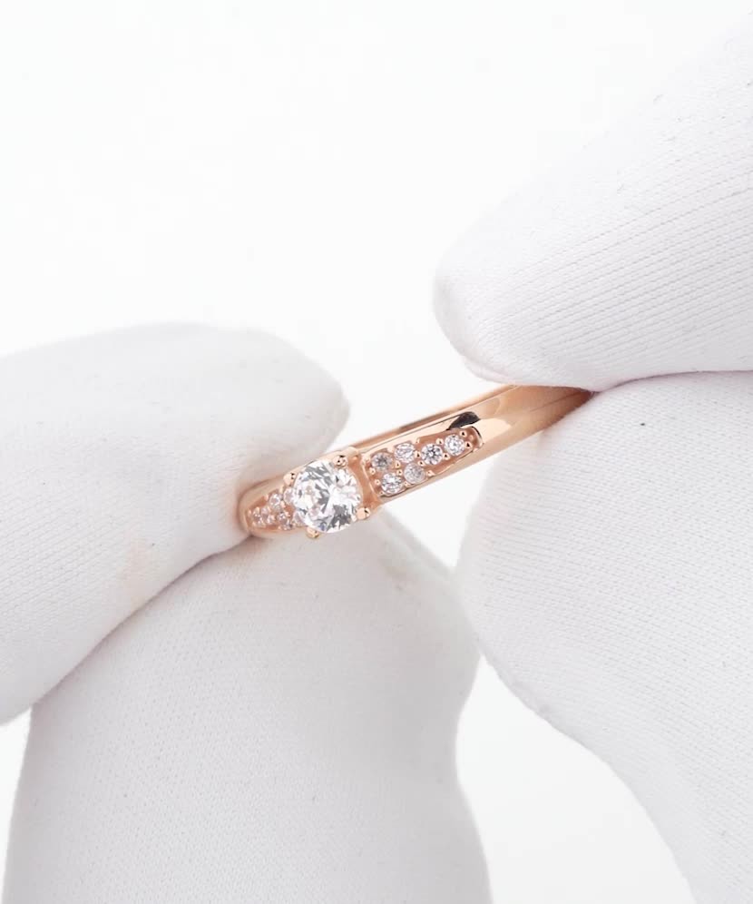 Gold ring with zircons