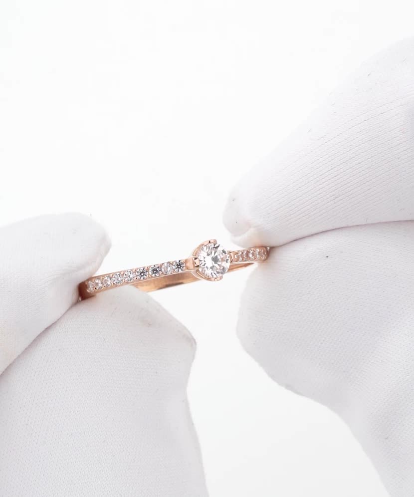 Gold ring with zircons