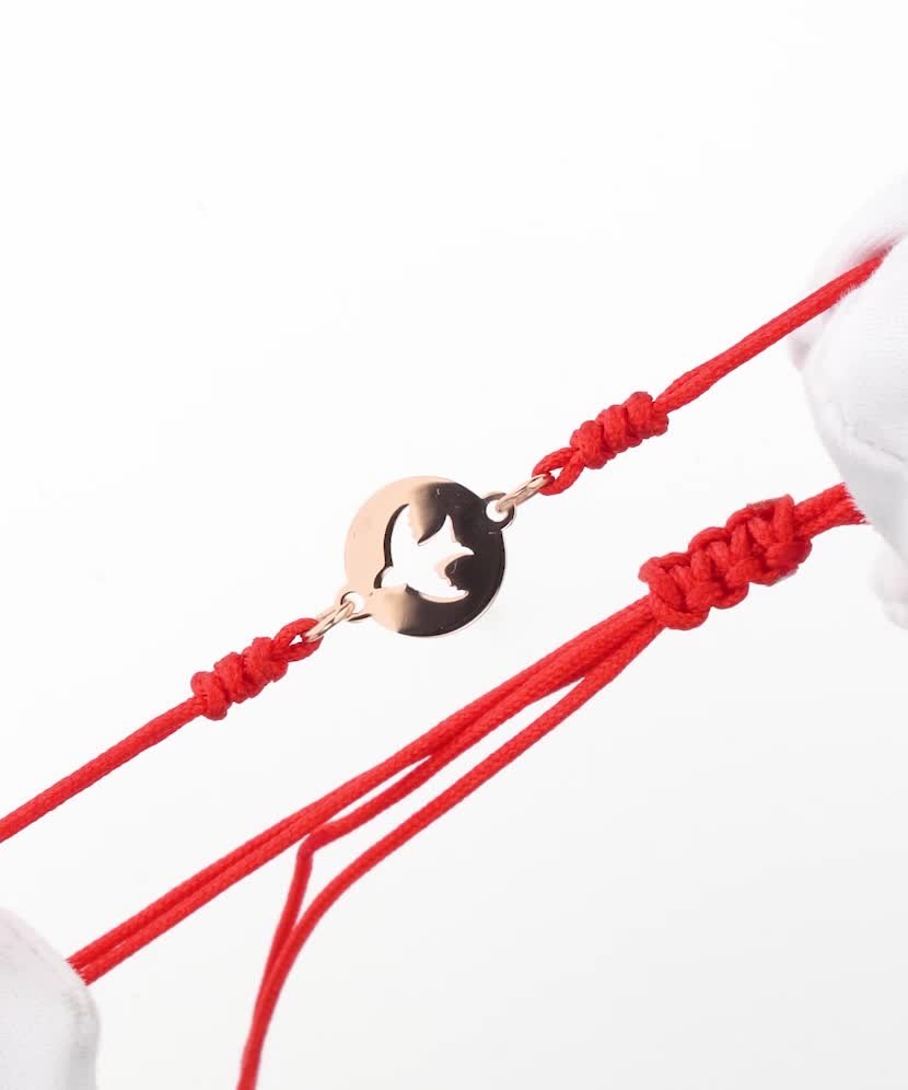 Red string bracelet with gold pendant