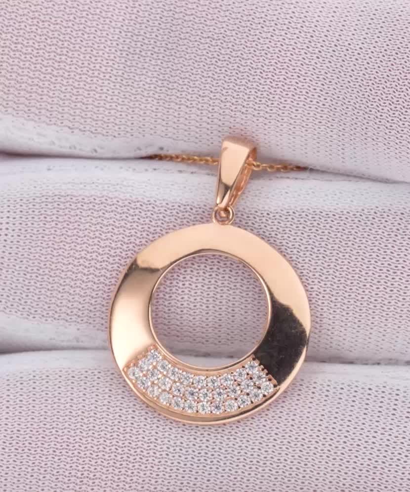 Gold pendant with zircons