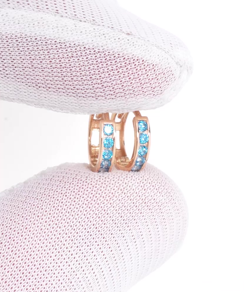 Gold earrings with zircons