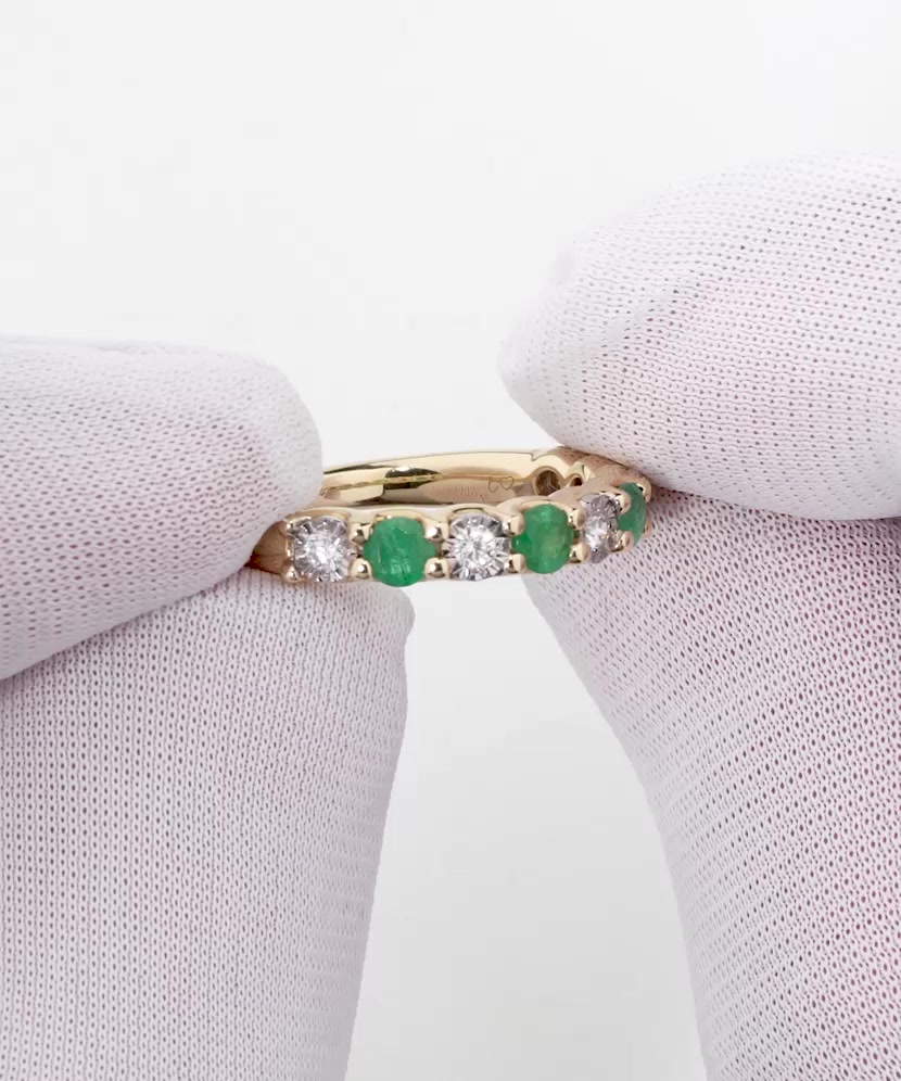 Yellow gold ring with diamonds and emeralds