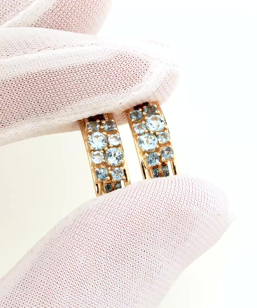 Yellow gold earrings with topazes and London topazes