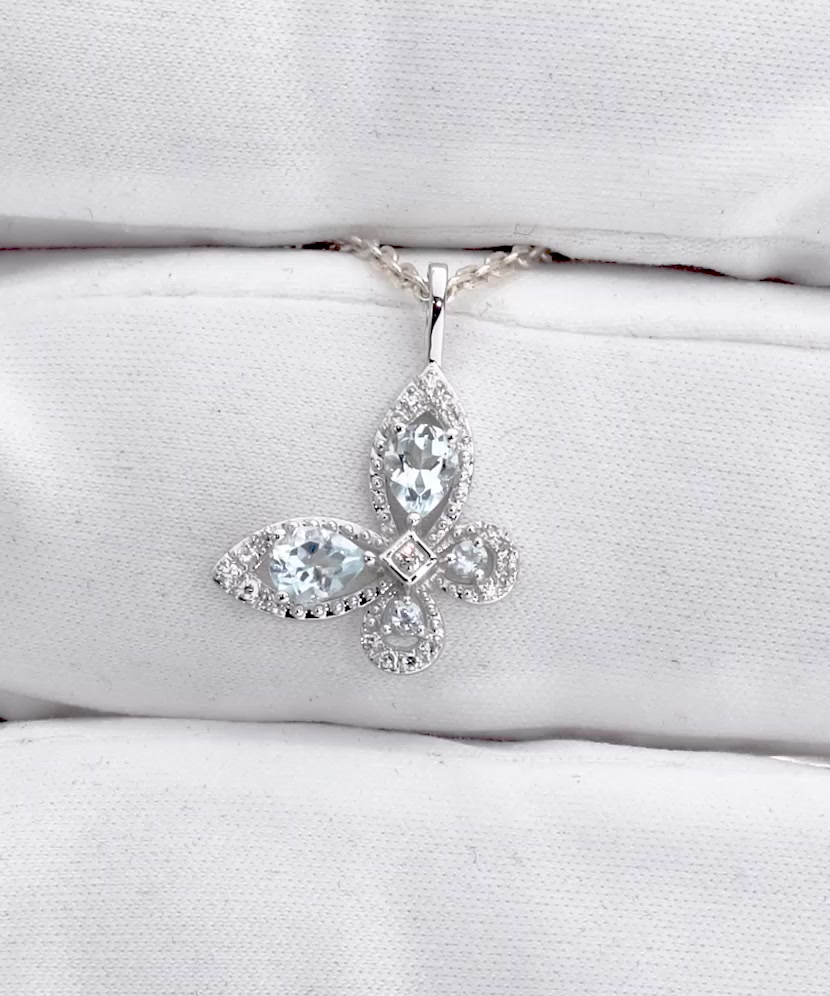 White gold pendant with topazes and diamonds