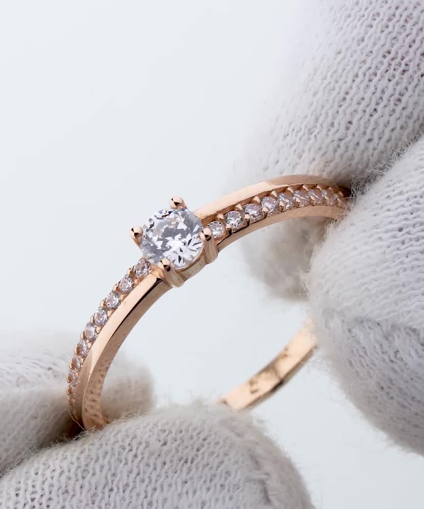 Gold ring with zircons