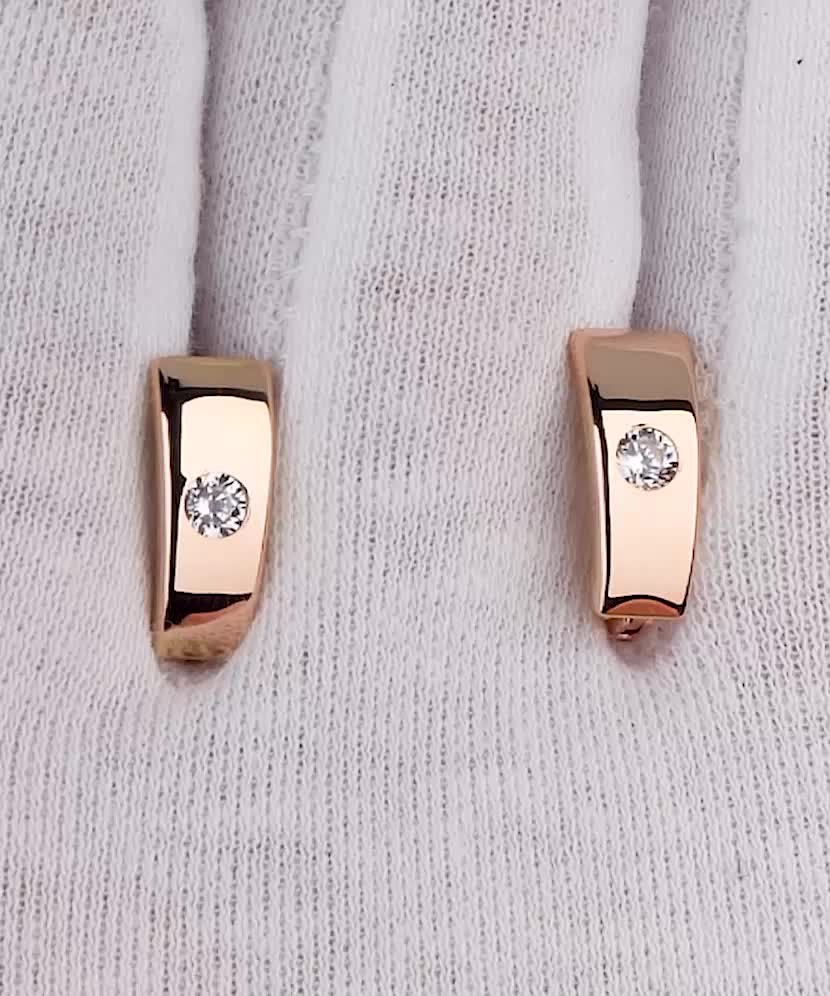 Gold earrings with zircons