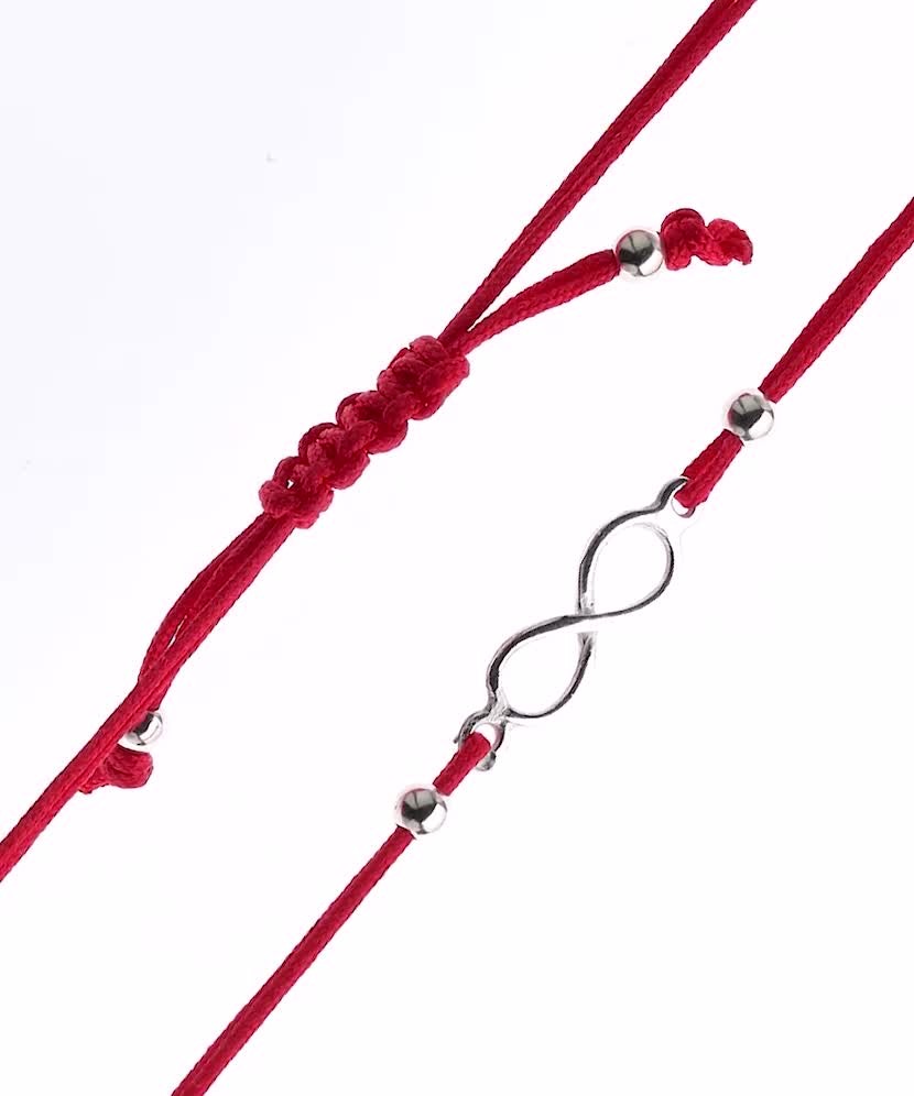 Браслет из красной нити с серебряной подвеской "Бесконечность"