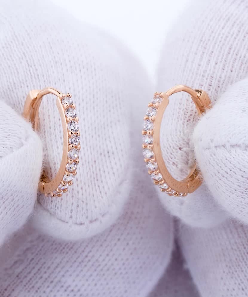 Gold hoop earrings with zircons