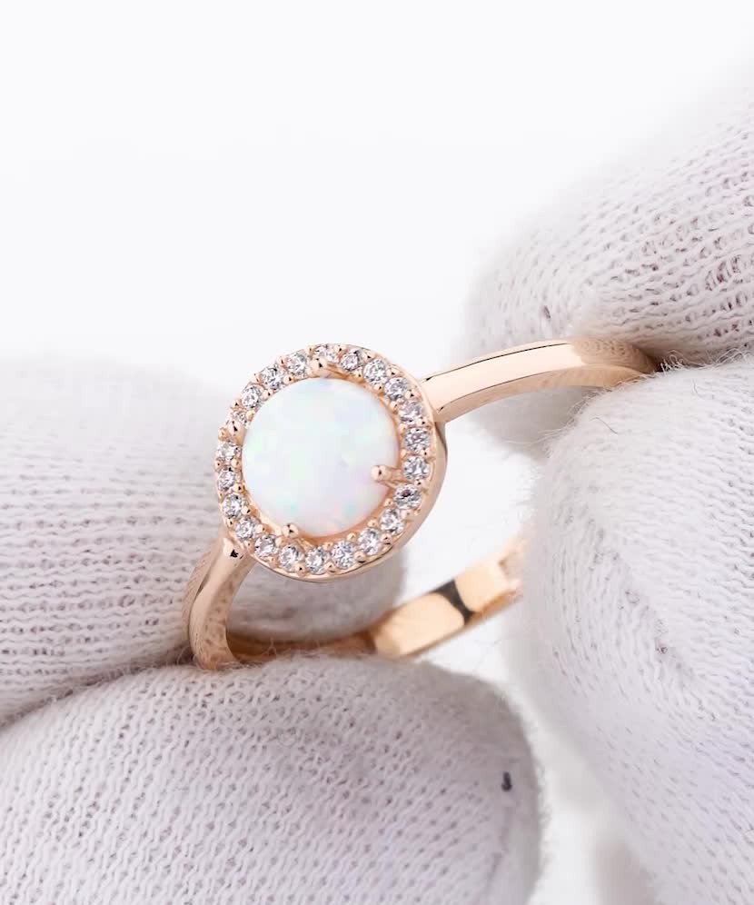 Gold ring with zircons and opal