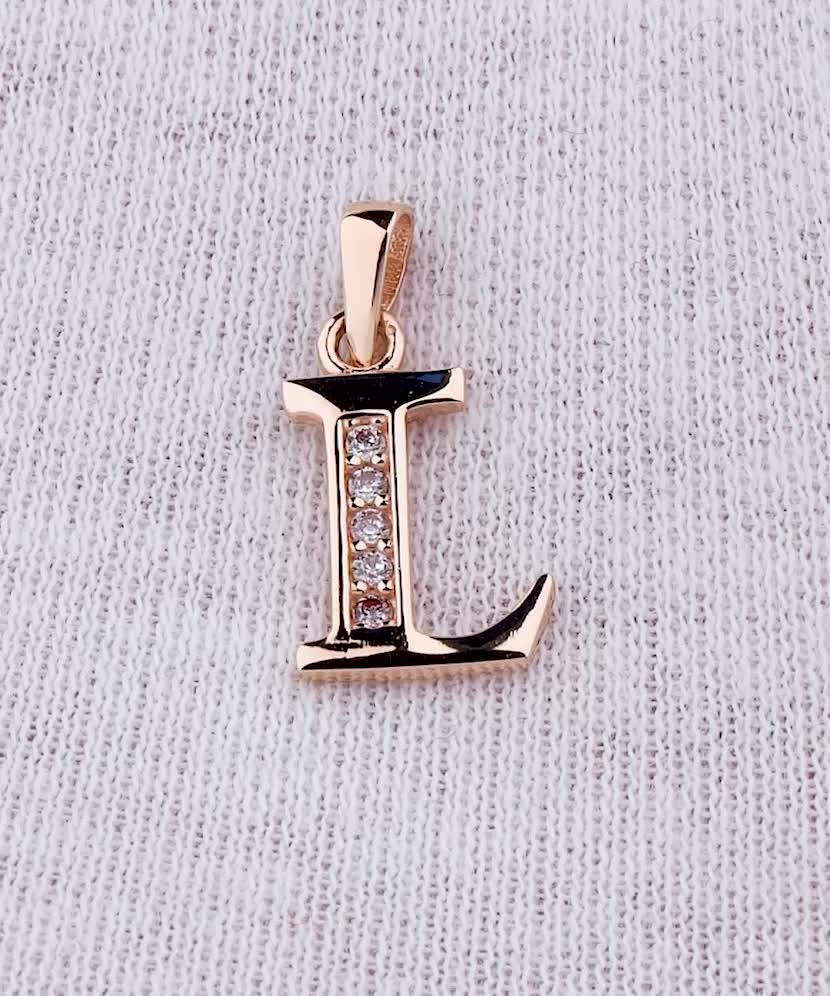 Gold pendant with zircons Letter L