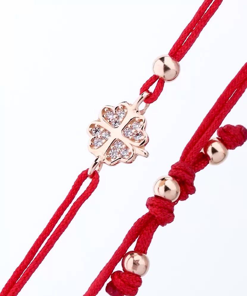 Red string bracelet with a gold pendant and zirconium "Dobilas"